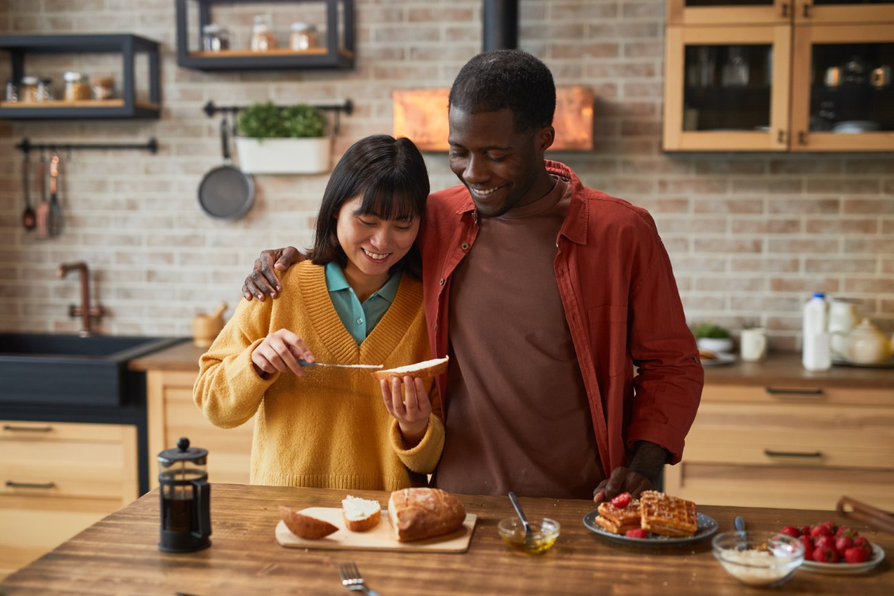 Couple Making Breakfast in Morning