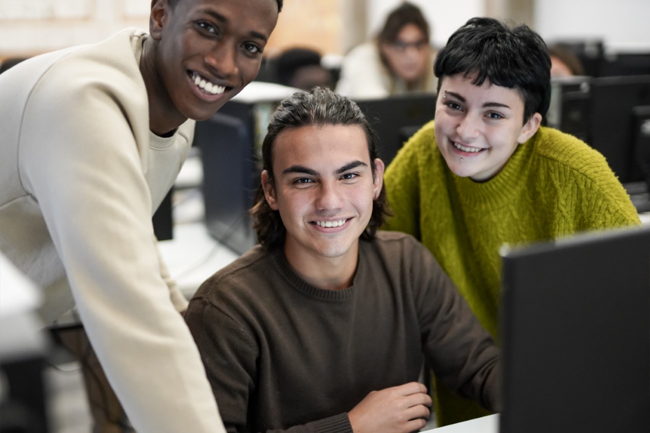 Young students smiling on camera – Technology and business class