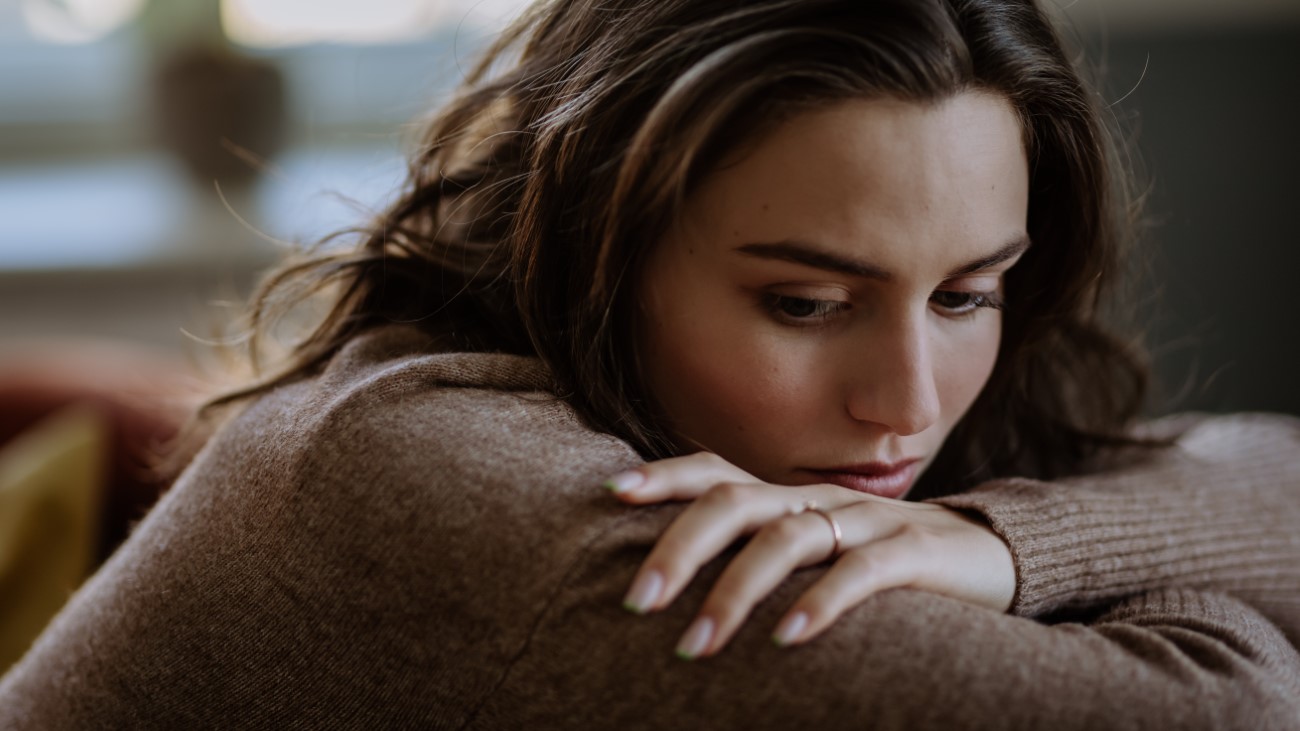 Portrait of unhappy young woman, concept of mental health.