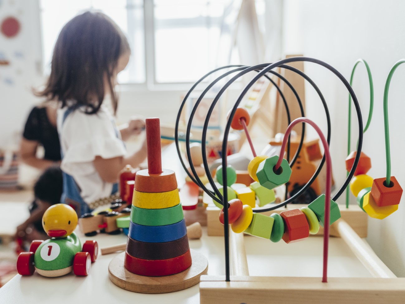 Young girl playing with educational toys